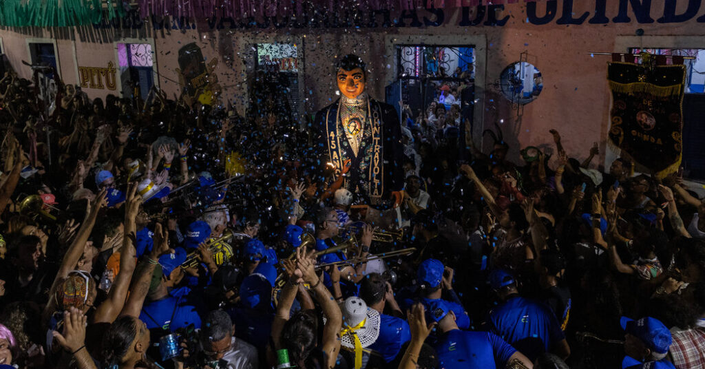 Brazil’s Carnival Solely Begins When 12-Foot John Travolta Arrives