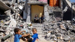 Battles rage throughout Gaza, Israel releases pictures of armed males at UN website