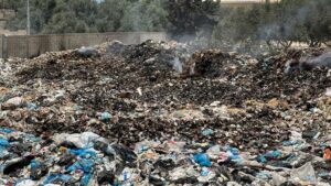 Large mounds of rotting trash pile up round Gaza camps, UNRWA says
