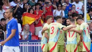 Olympics Day 15: France falls in soccer, U.S. relay mishap, breaking debuts