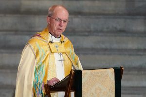 Who’s the Archbishop of Canterbury and why are there requires him to resign?