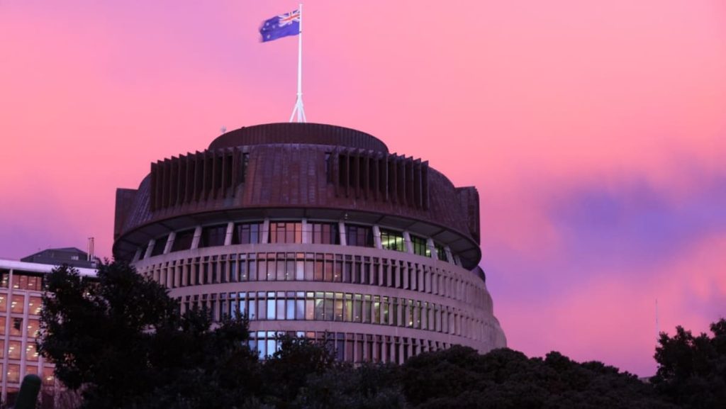 New Zealand minister quits after placing hand on staffer’s arm
