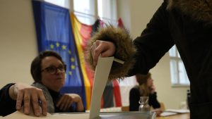 Germans vote below shadow of far-right surge and Trump