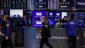 Gold tops ,000 for first time on Trump tariff struggle, shares rebound
