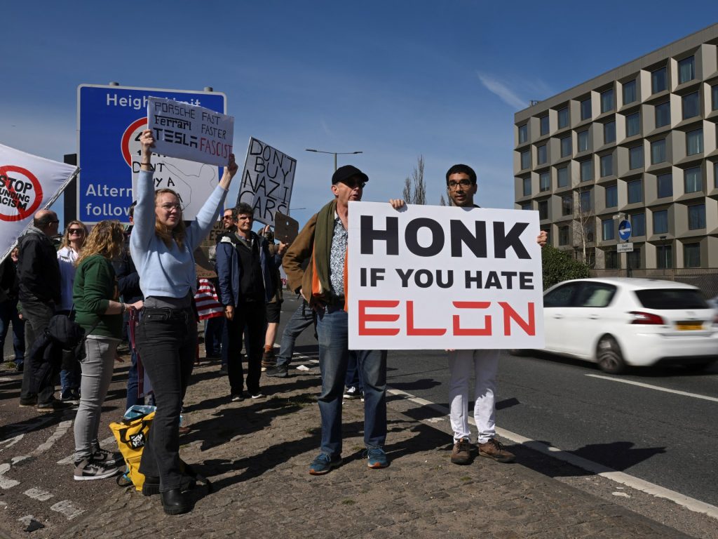 Elon Musk protesters collect at Tesla showrooms | Donald Trump Information