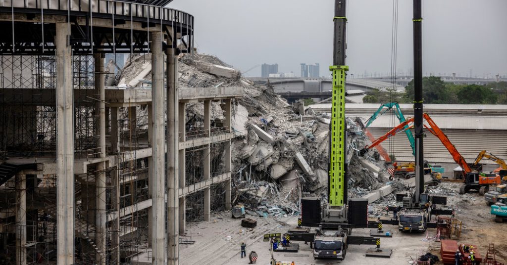As Rescuers Work at Collapsed Bangkok Constructing, These Who Discovered Love There Await Information