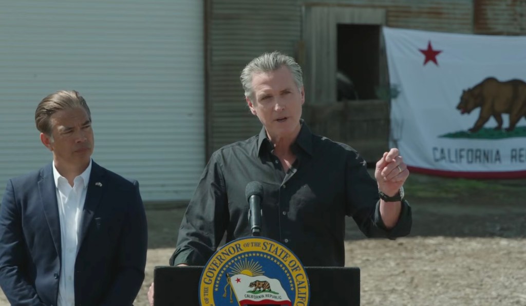 Newsom Blasts”Poisonous Uncertainty” As California Sues Trump Over Tariffs Newsom Blasts”Poisonous Uncertainty” As California Sues Trump Over Tariffs