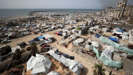 Palestinians flock to US-backed support centres regardless of concern over checks