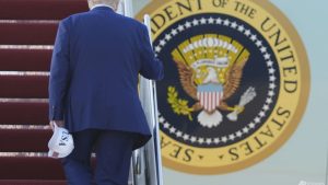 Heading to NATO summit, Trump casts doubt on mutual defence