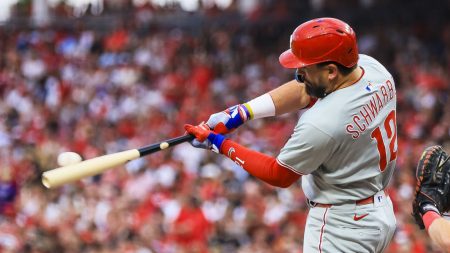 Schwarber continues to gas surging Phillies in win over Reds